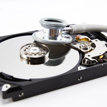 stethoscope on the hard disk drive over white